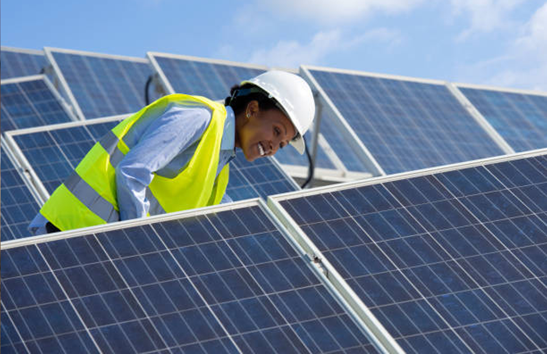 Engineer inspecting a solar panel installation